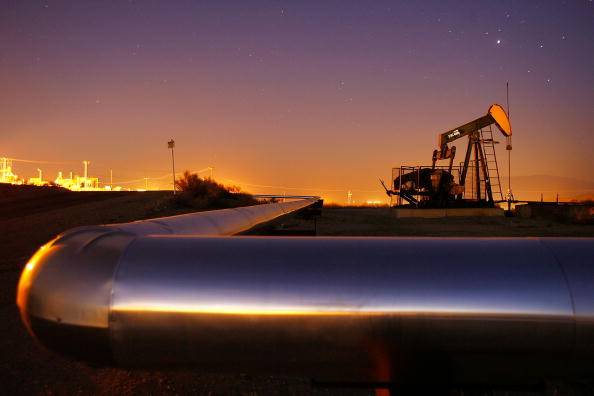 TAFT, CA - JULY 21:  An oil rig south of town extracts crude on July 21, 2008 in Taft, California. Hemmed in by the richest oil fields in California, the oil town of 6,700 with a stagnated economy and little room to expand has hatched an ambitious plan to annex vast expanses of land reaching eastward to Interstate 5, 18 miles away, and take over various poor unincorporated communities to triple its population to around 20,000. With the price as light sweet crude at record high prices, Chevron and other companies are scrambling to drill new wells and reopen old wells once considered unprofitable. The renewed profits for oil men of Kern County, where more than 75 percent of all the oil produced in California flows, do not directly translate increased revenue for Taft. The Taft town council wants to cash in on the new oil boom with increased tax revenues from a NASCAR track and future developments near the freeway.  In an earlier oil boom era, Taft was the site of the 1910 Lakeside Gusher, the biggest oil gusher ever seen in the US, which destroyed the derrick and sent 100,000 barrels a day into a lake of crude.  (Photo by David McNew/Getty Images)