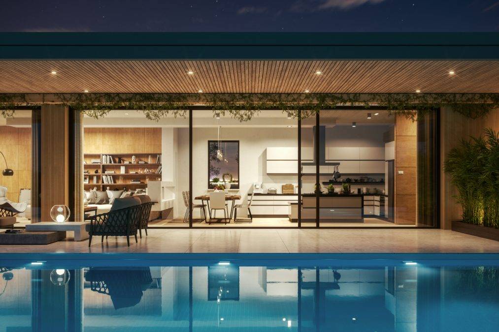 Casa de luxo com piscina à noite (Getty Images)