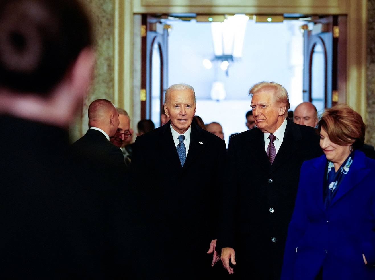 Washington , DC - January 20:  U.S. President Joe Biden and President-elect Donald Trump arrive ahead of the 60th inaugural ceremony on January 20, 2025, at the US Capitol in Washington, DC. Trump becomes the 47th president of the United States in a rare indoor inauguration ceremony. The parade was also moved inside Capitol One Arena due to weather. Melina Mara/Pool via REUTERS