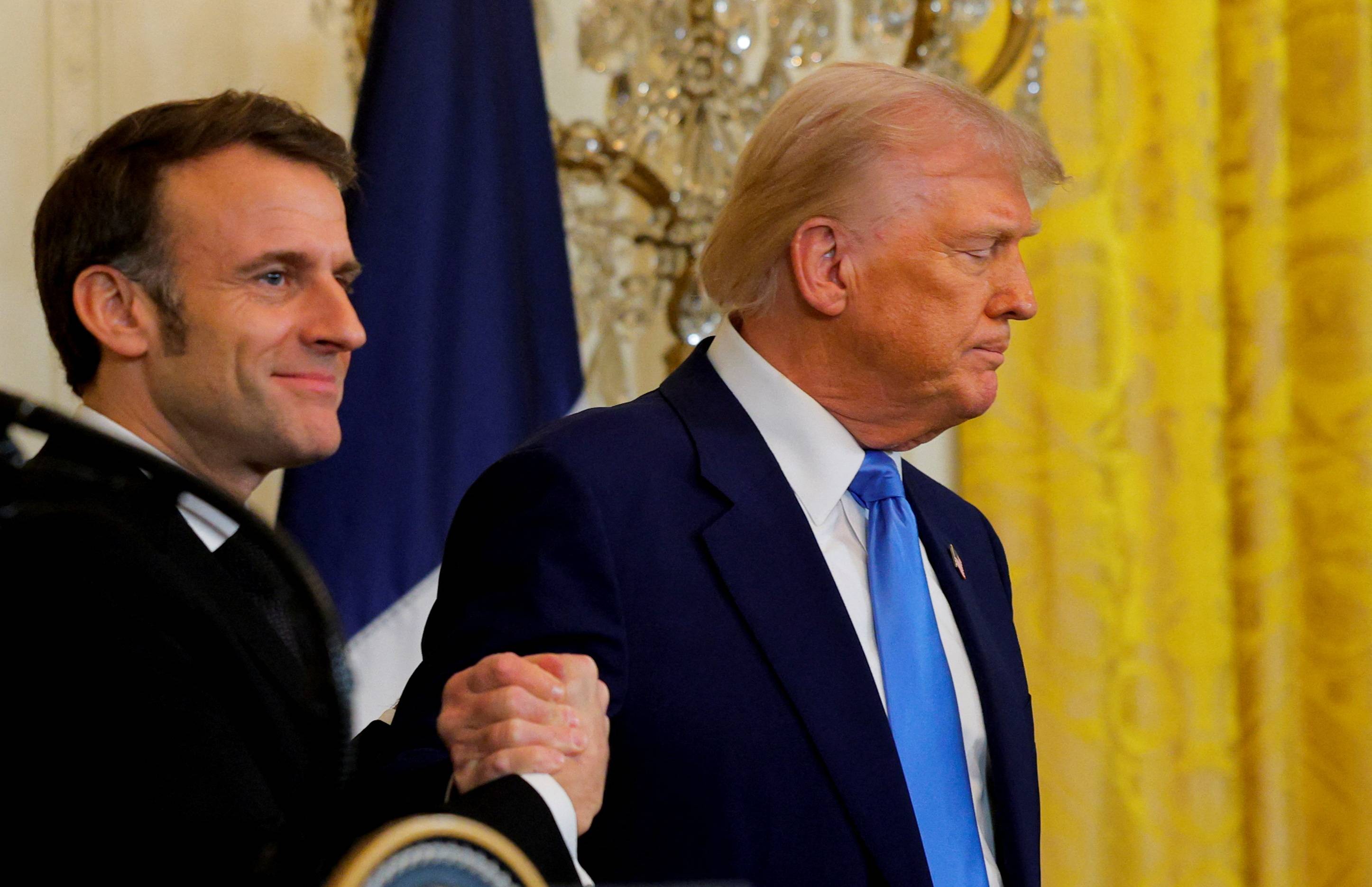 Donald Trump e Emmanuel Macron em Washington
 24/2/2025     REUTERS/Brian Snyder