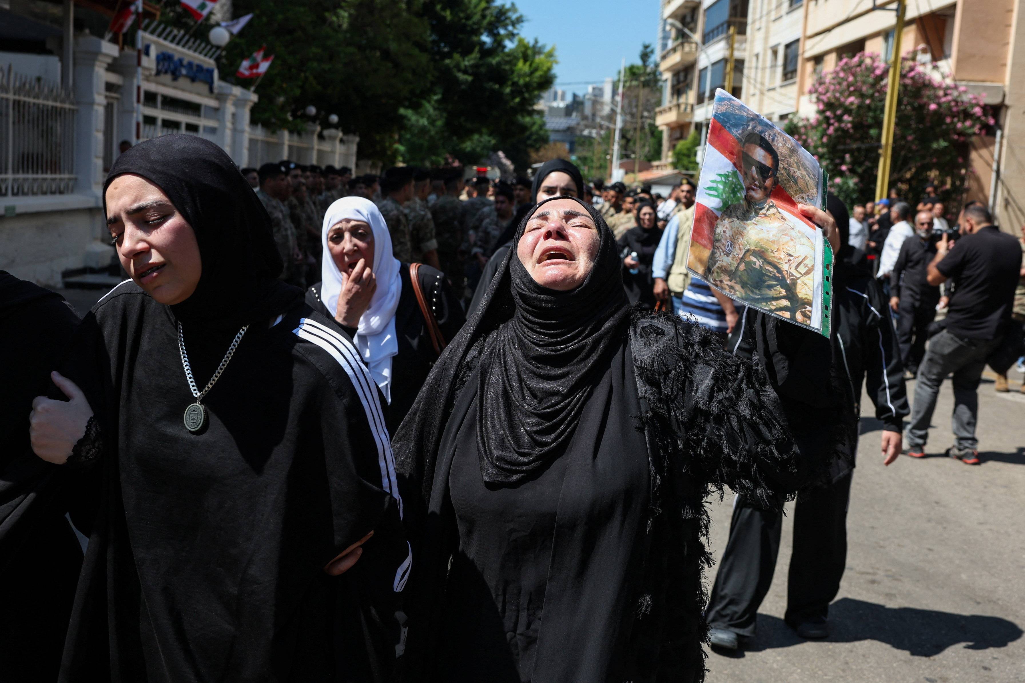 A mourner reacts during the funeral of Brigadier General Wissam Sabra, who was killed in an Israeli strike targeting their military vehicle on the Khardali-Nabatieh road in south Lebanon on Saturday, in Beirut, Lebanon June 7, 2026. REUTERS/Mohamed Azakir